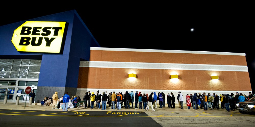 Shoppers wait in line outside a Best Buy Co. store prior to the store's midnight opening in Peoria, Illinois, U.S., on Thursday, Nov. 22, 2012. Discount store shoppers are prepared to wait in long lines on Black Friday, though they are skeptical about whether they'll get the best deals of the season. Photographer: Daniel Acker/Bloomberg via Getty Images