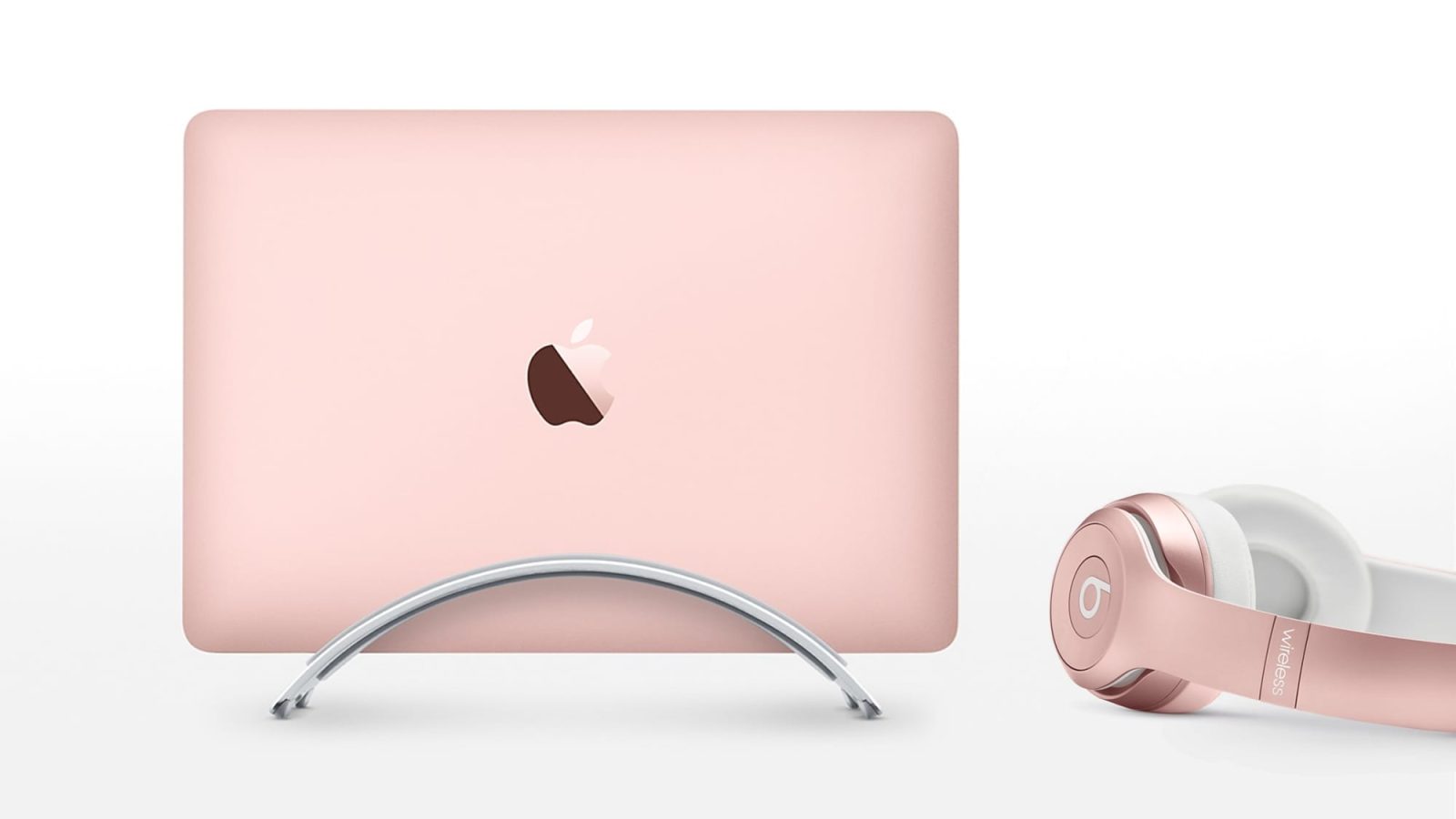 Rose Gold MacBook next to Beats Solo2 Wireless (Credit: Apple)