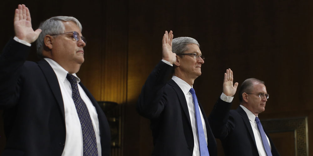 Tim Cook with other senior Apple execs at the U.S. Senate hearing in 2013