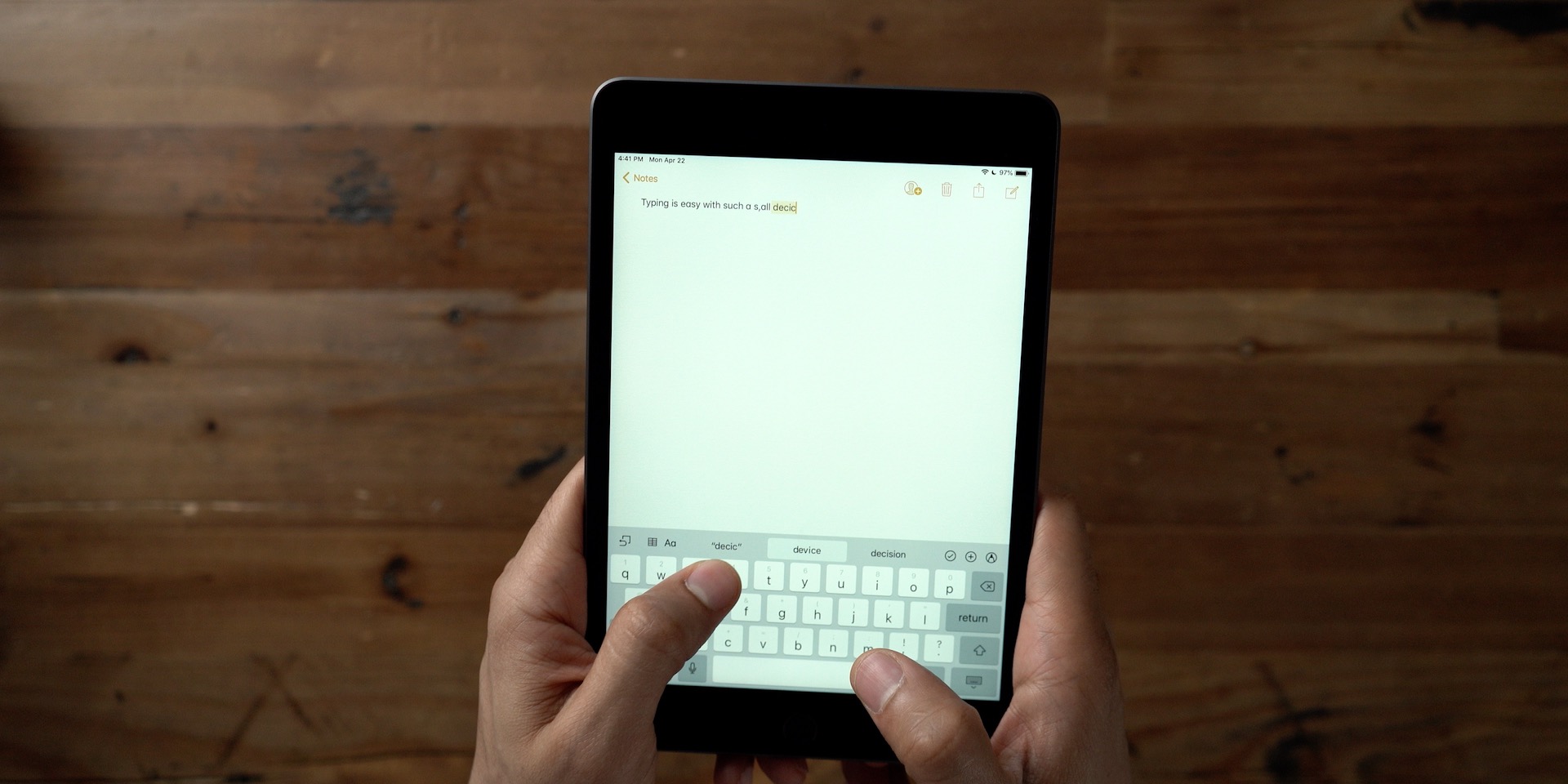 Which iPad Should You Buy? iPad mini handheld typing