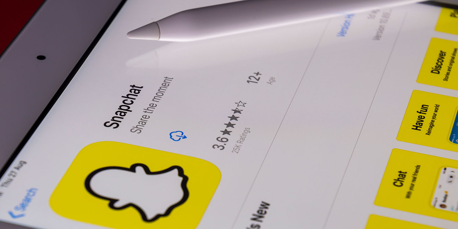 Snapchat Plus | Close-up of iPad and Apple Pencil, showing Snapchat in the App Store