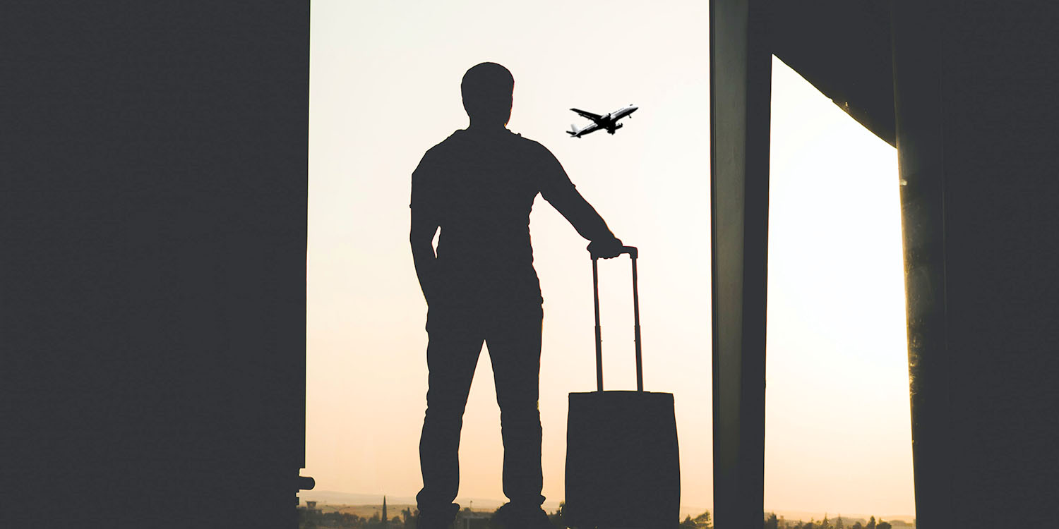 AirTags in baggage | Silhouette of man with bag in airport