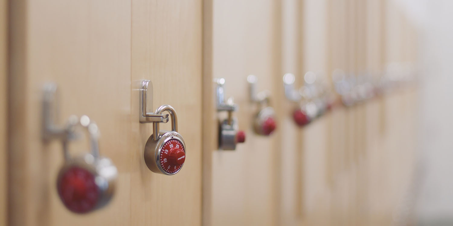 Twitter DMs | A row of lockers with padlocks