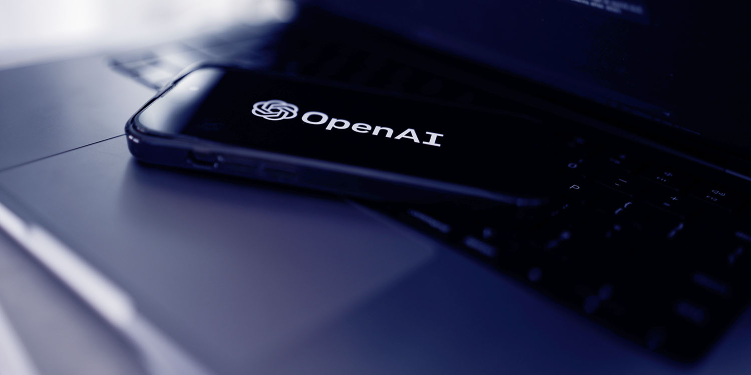 ChatGPT for iOS updated | iPhone with OpenAI logo
