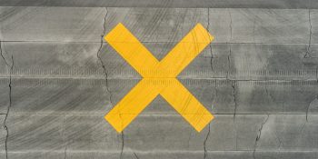Brands ceasing ads on X | Disused runway marked by X warning symbol