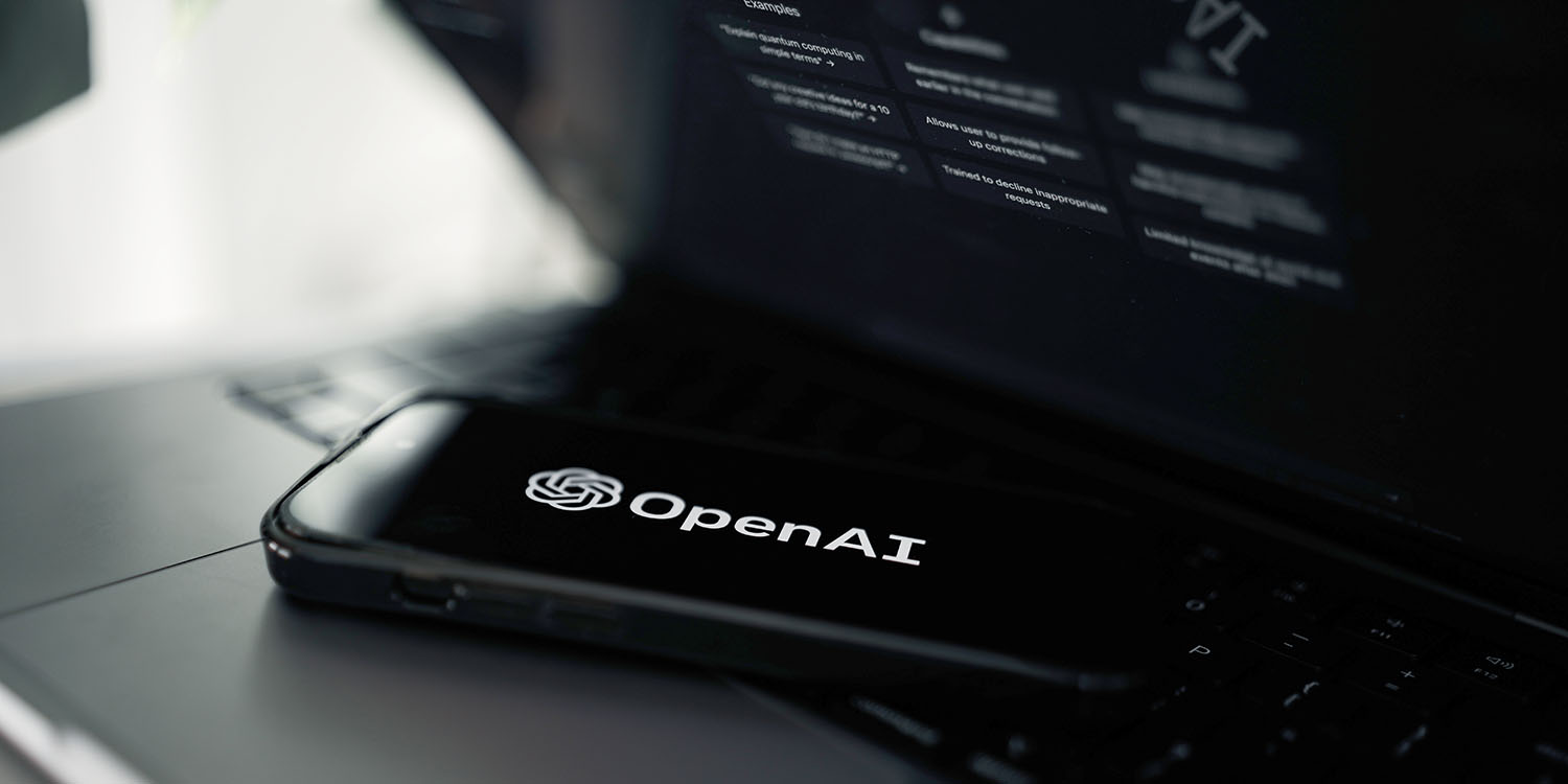 OpenAI boardroom coup defeated | Smartphone with company logo